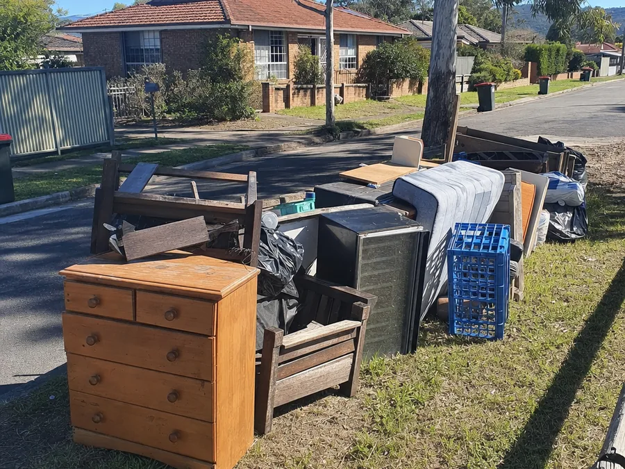 Furniture and junk on the nature strip, before